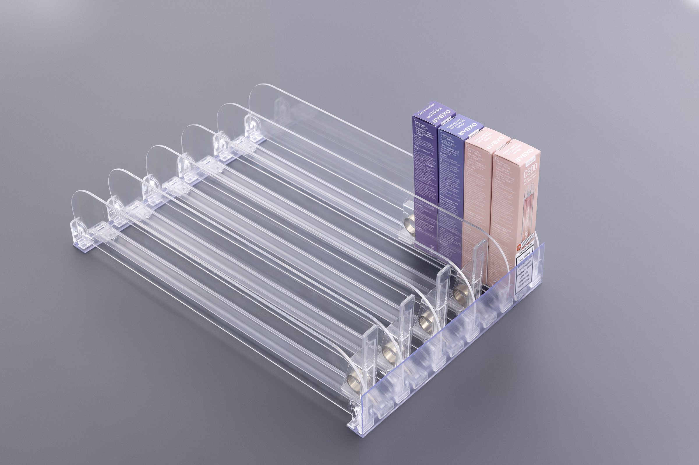 Slim cosmetic shelf pusher